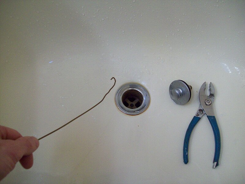 How to Free a Clogged Bathtub Drain Filled with Hair